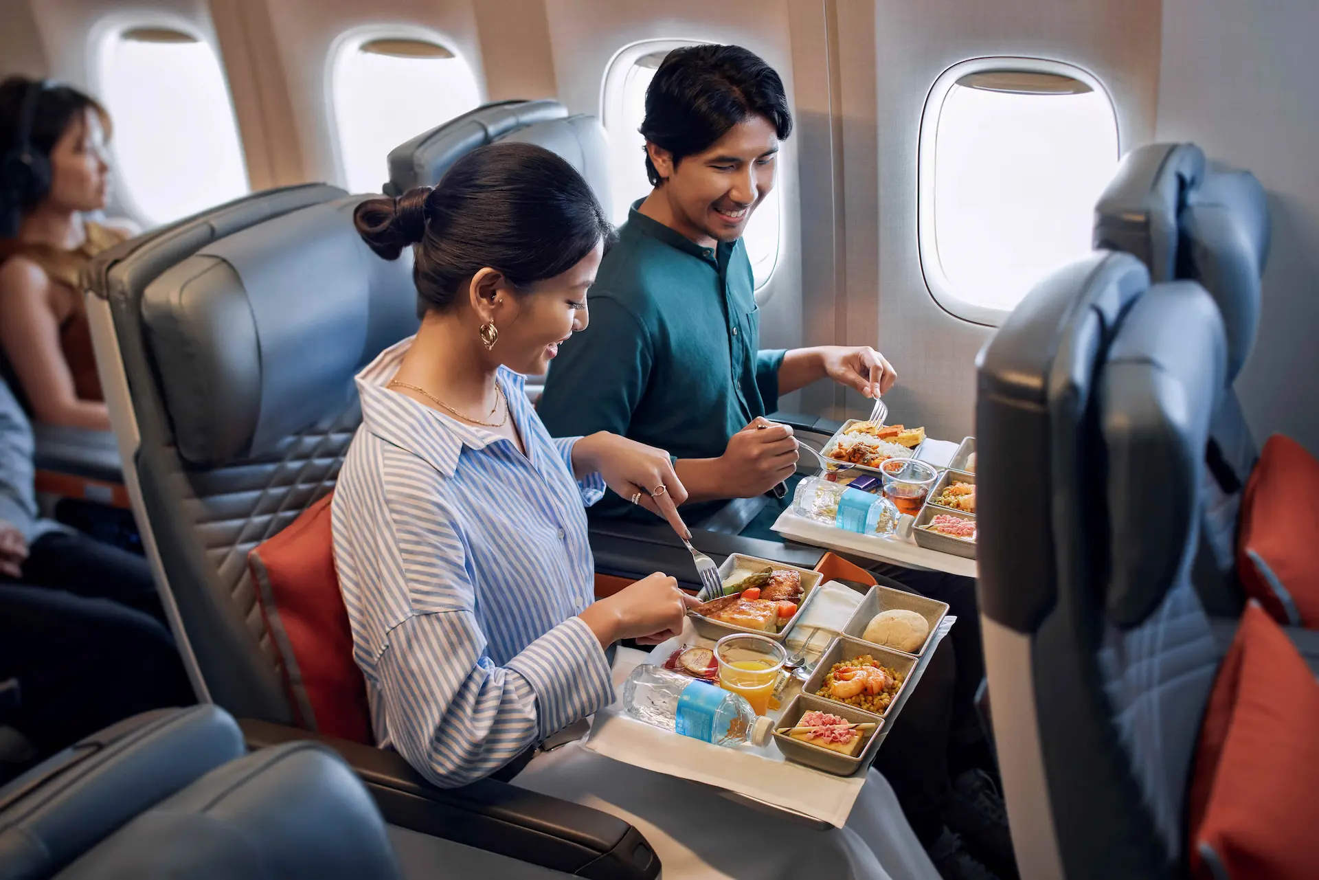 Couple Enjoying Singapore AirlinesPremium Economy Class