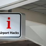 Traveler inside a modern airport terminal near departure gates, illustrating airport hacks that help save time, reduce stress, and move through airports faster.