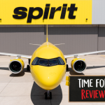 Spirit Airlines yellow plane at modern airport terminal