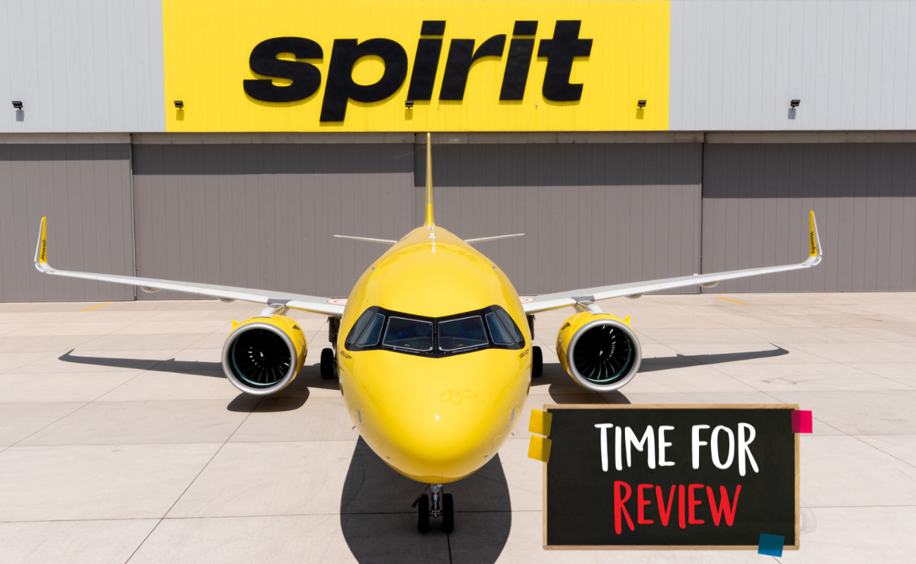 Spirit Airlines yellow plane at modern airport terminal