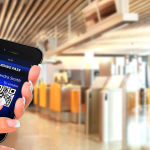 Mobile boarding pass displayed on a smartphone held inside an airport terminal
