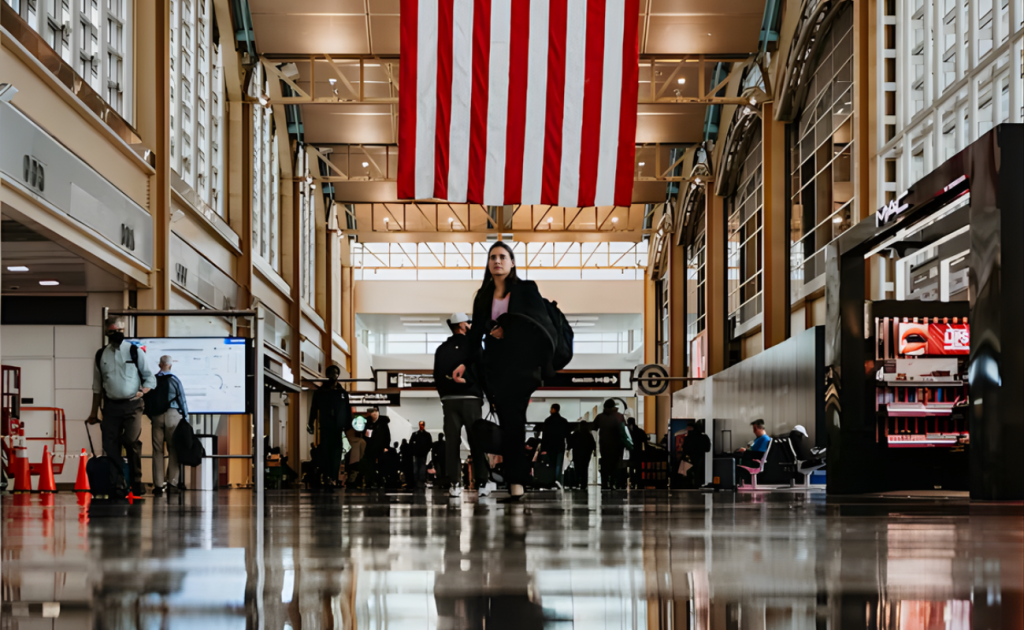 Airport terminal scene illustrating what happens if passengers don’t check in early under 2026 airline rules.