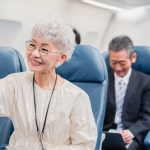 Senior Passenger seated comfortably after changing seats following airline rules in 2026.