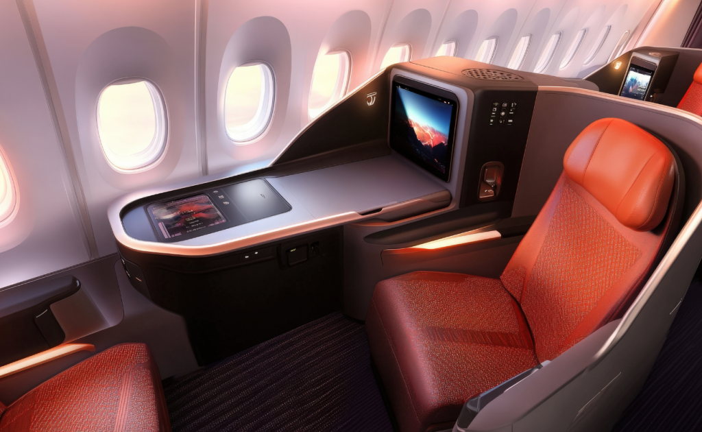 Economy class airline seat showing limited legroom and knee space between rows