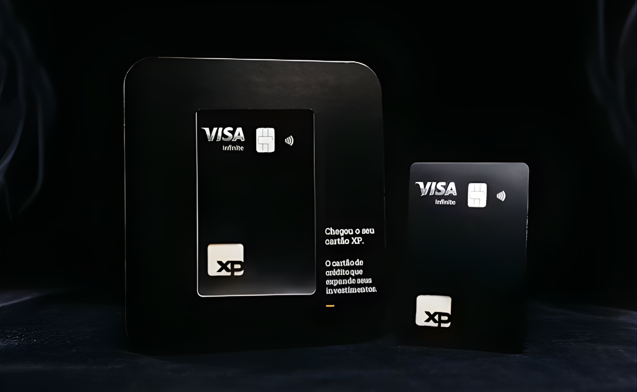 Sleek black XP Visa Infinite credit cards displayed dramatically, highlighting premium design and lounge benefits.