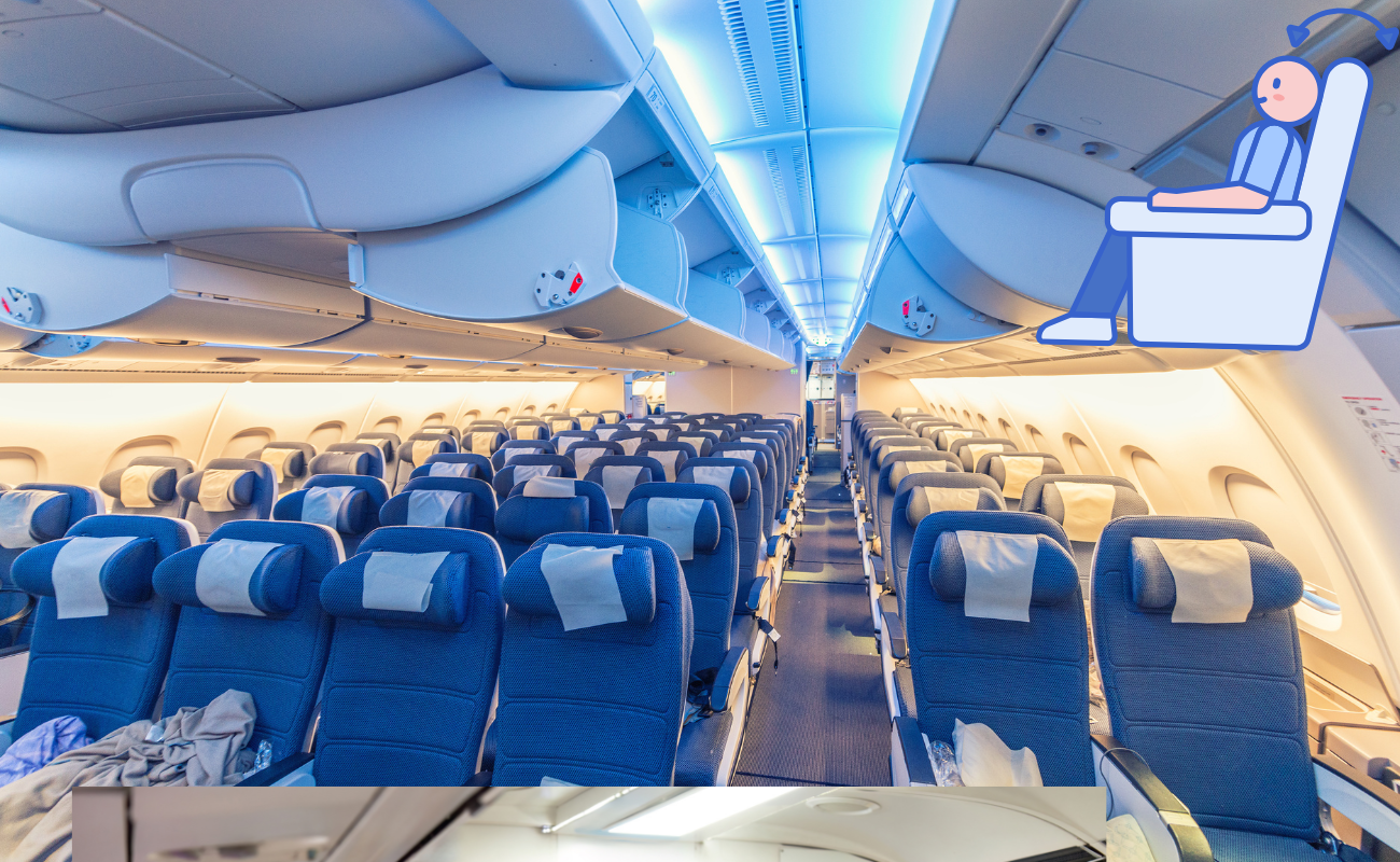 Economy class airplane cabin with rows of blue seats and overhead bins during flight