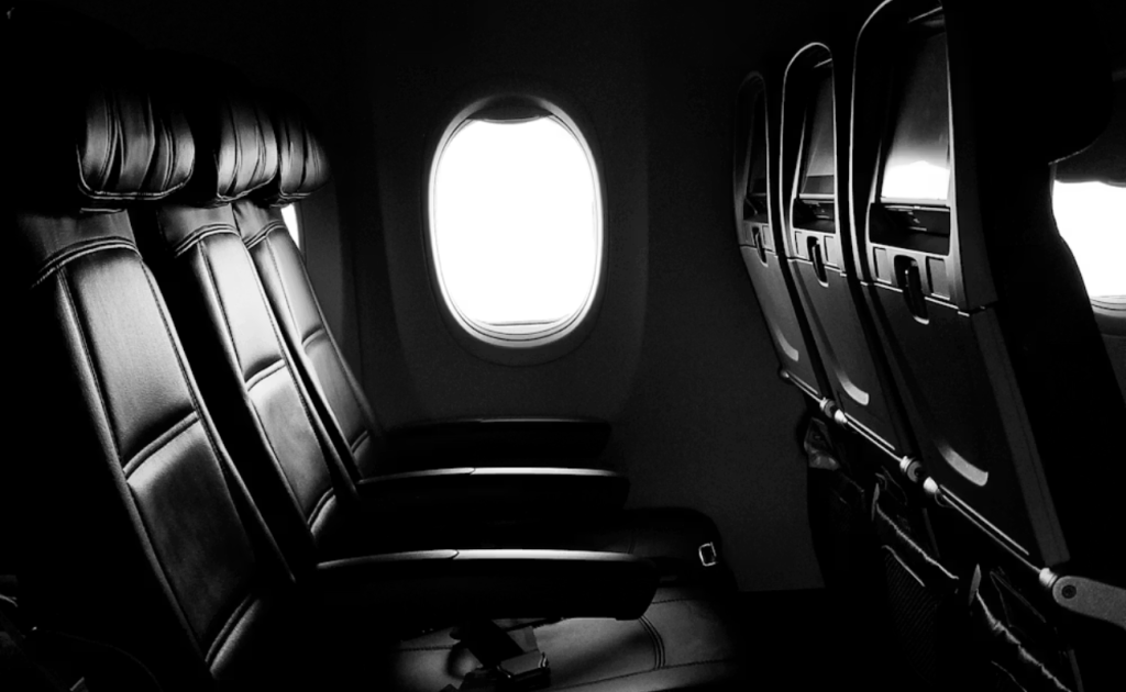 Window seat view inside airplane cabin