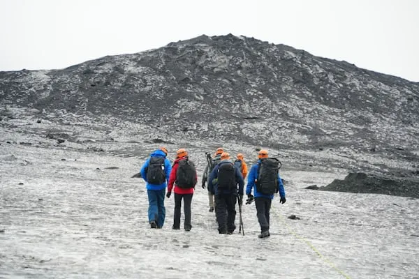 solo travelers enjoying the group travel in icy cold mountains.